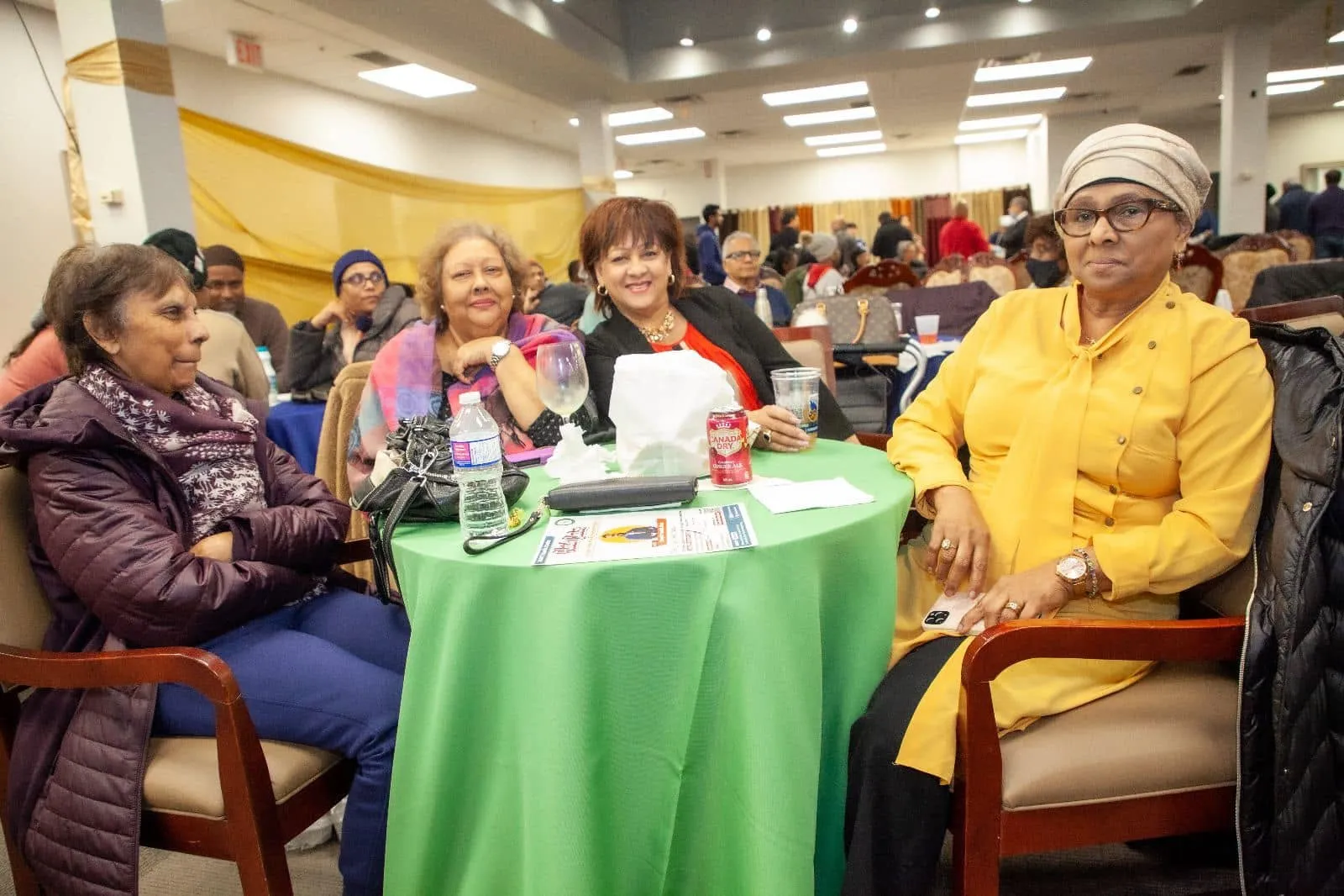 Guests seated at a table at Pepperpot Fest